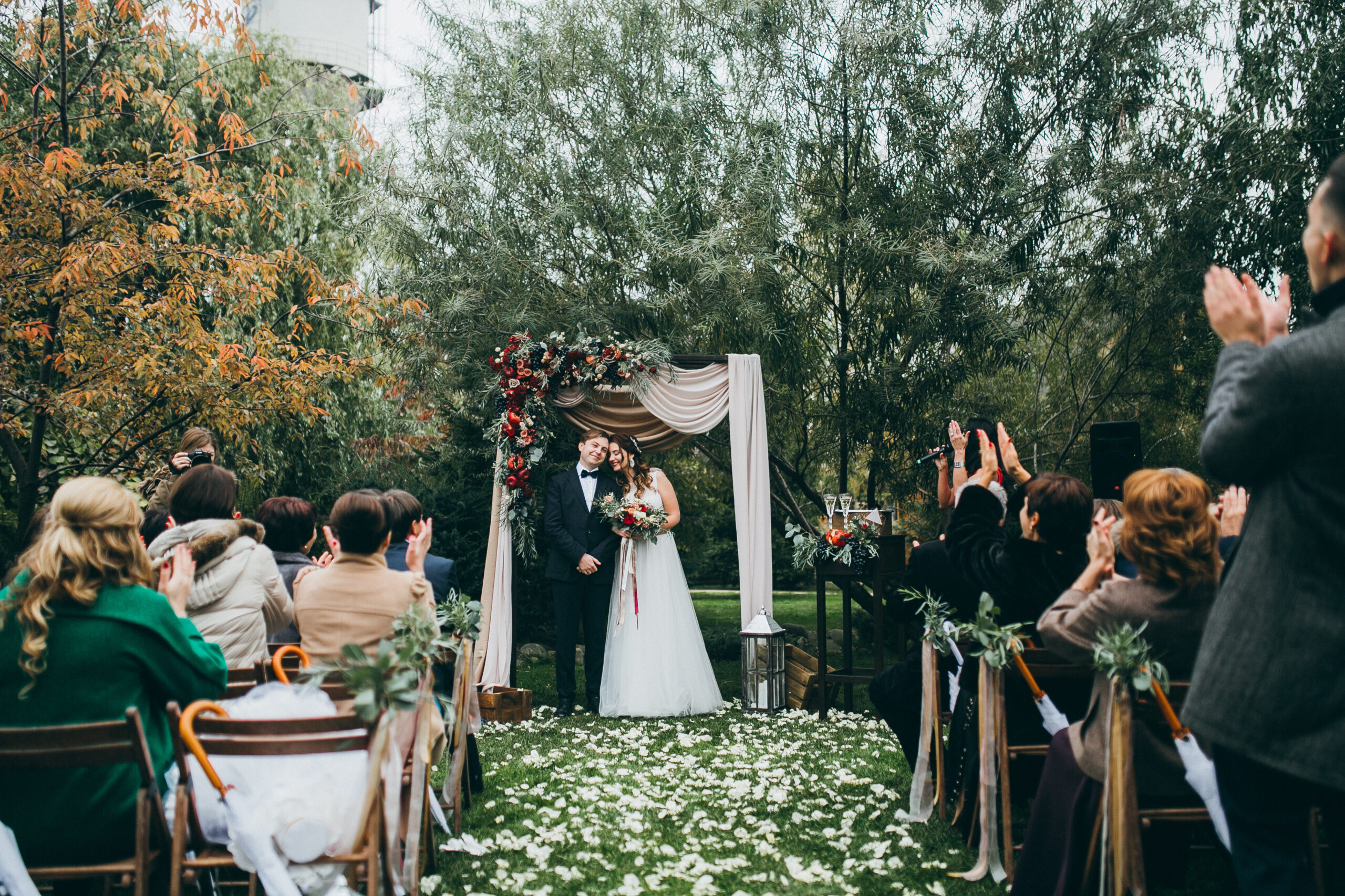 Beautiful wedding couple on the wedding autumn ceremony